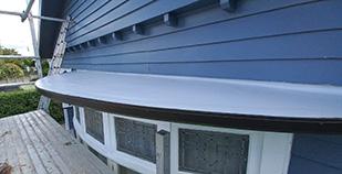 Curved bay window re-roof with membrane