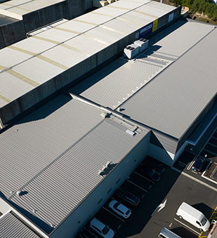Factory re-roofing project with a warm roof